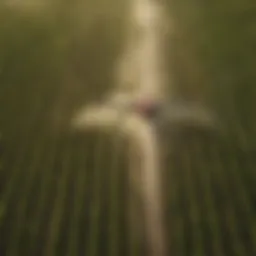 Aerial view of a farm being sprayed with agricultural equipment