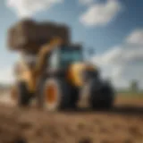 Used loader working in a field