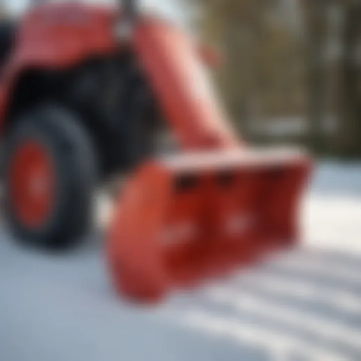 Close-up of a snow blower attachment on a garden tractor