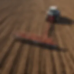 A modern drag rake in action on a field, showcasing its efficiency in soil preparation.